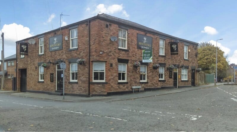 DESCRIPTION The Honeysuckle is a beautiful traditional red brick building situated in Pool Street, Wigan, which is approximately 1⁄2 mile from Wigan town centre and close to both Wigan Pier and Trenderfield Mill. The pub is surrounded by both terraced housing and bungalows and is ideally situated on a busy crossroads creating extra footfall.