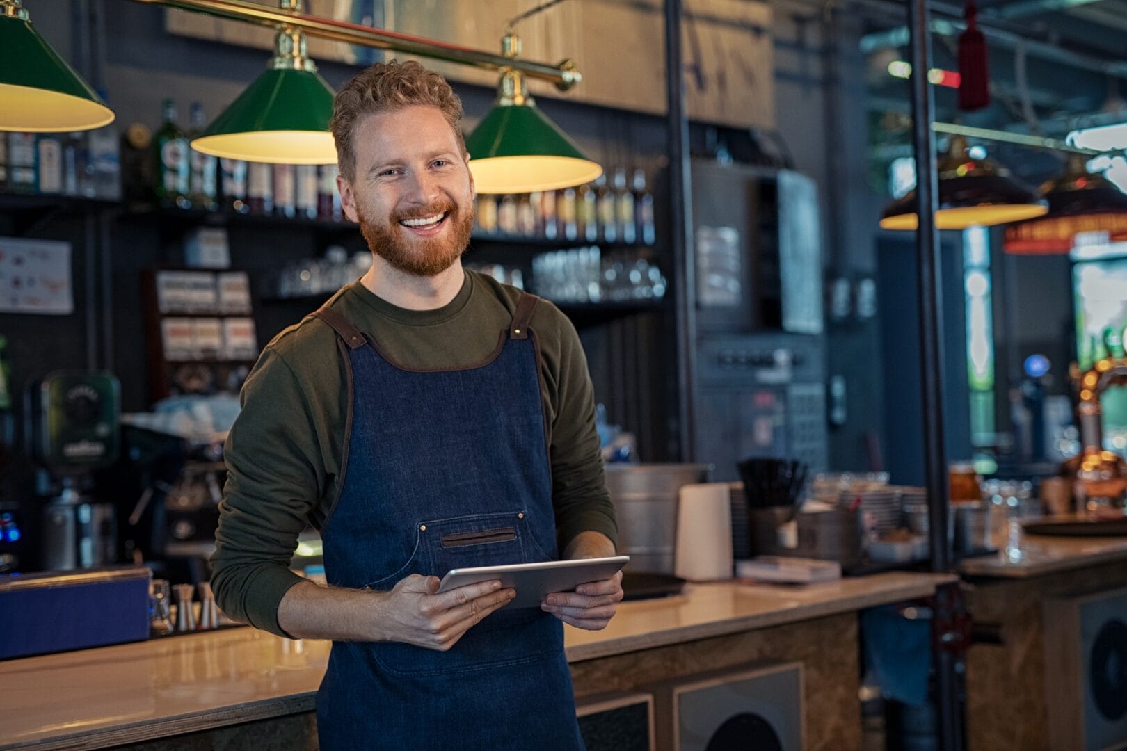 Successful,Small,Business,Owner,Using,Digital,Tablet,And,Looking,At